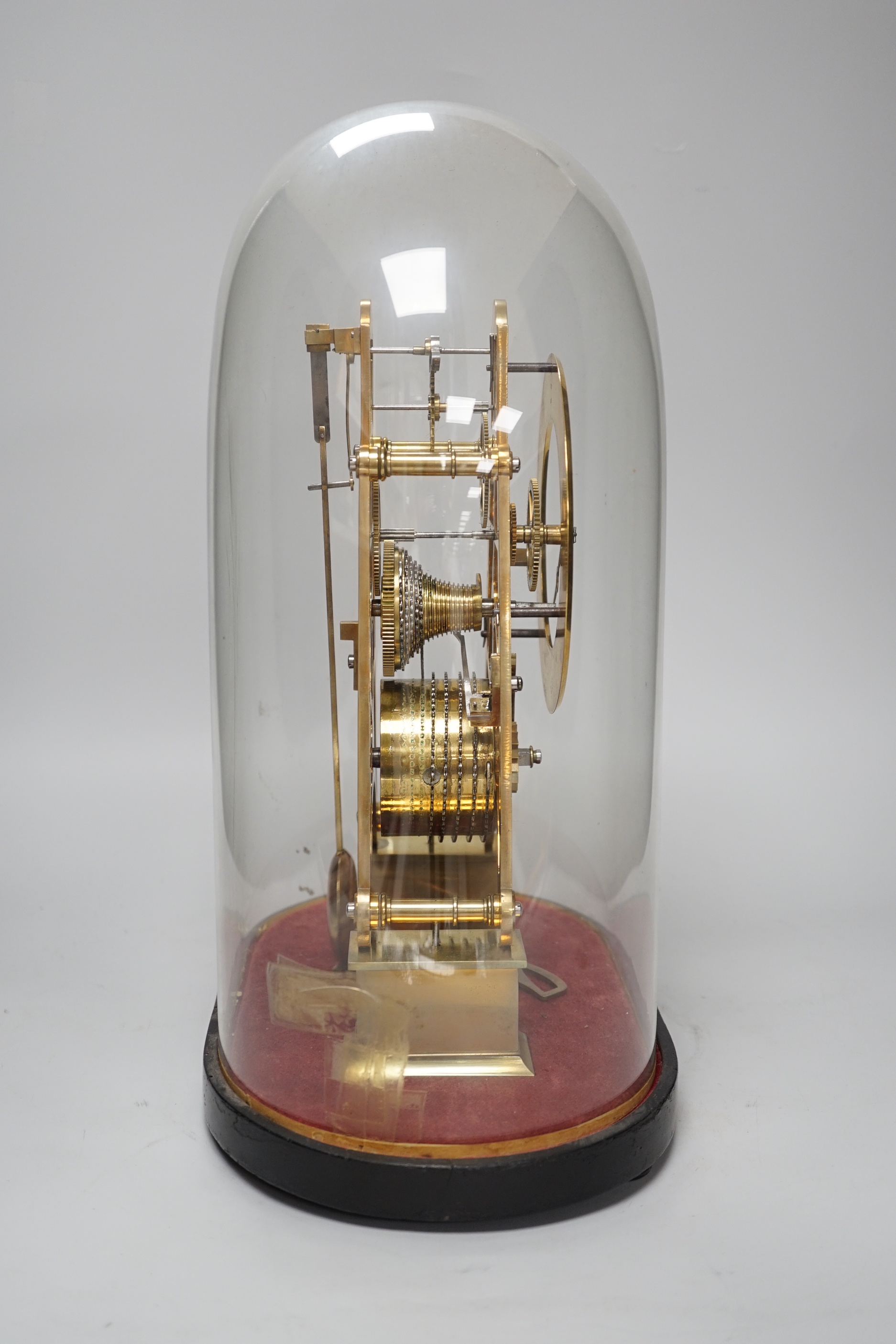 Simmons of London. A brass single fusee skeleton clock under dome, 38cm tall